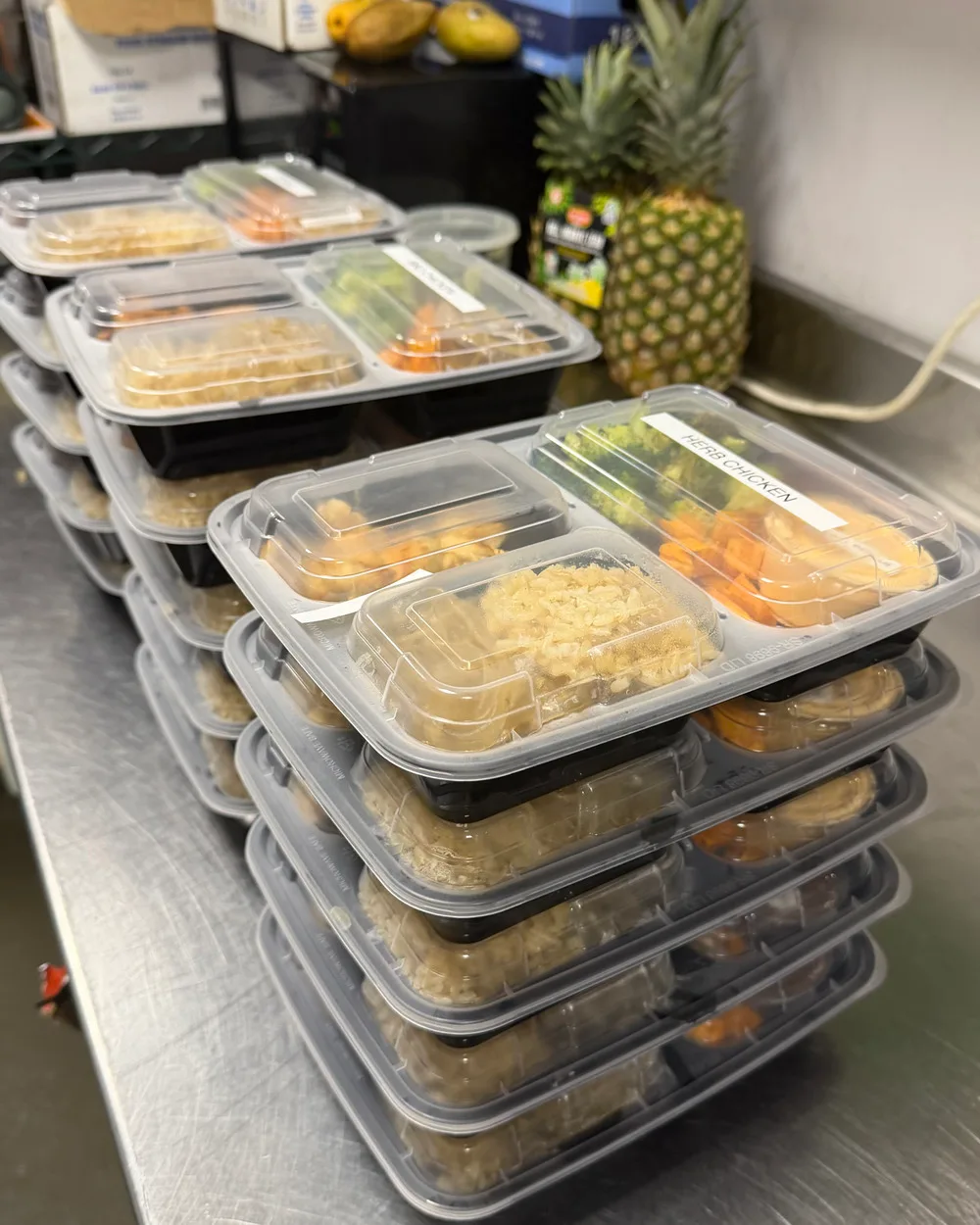 Stacked, labeled Brack's meal boxes ready for office delivery